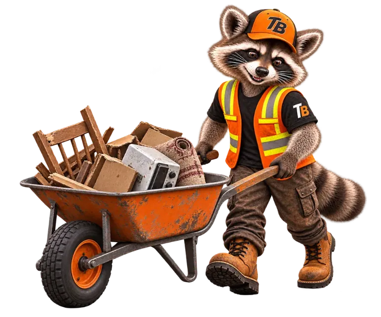 Trash Bandits raccoon mascot pushing a wheelbarrow full of old furniture and junk